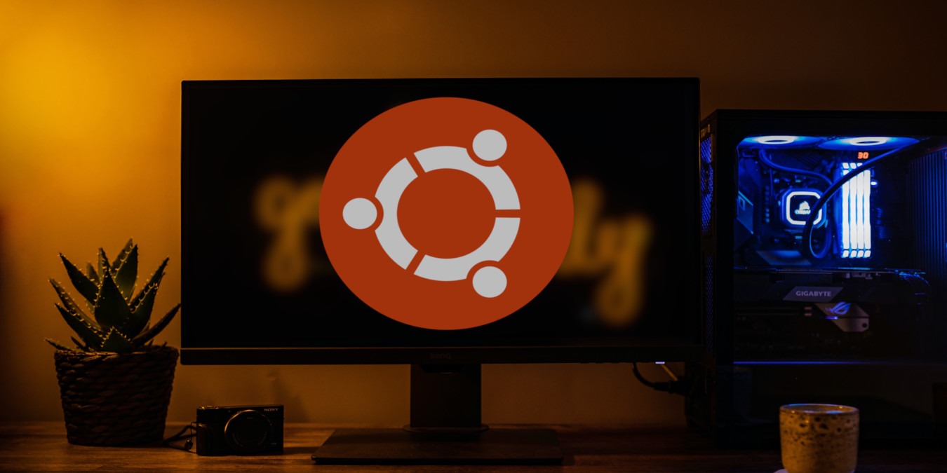 A photograph of a desktop with an Ubuntu logo in the middle.