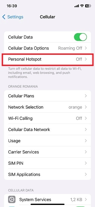 Tapping on "Personal Hotspot" option on iPhone.