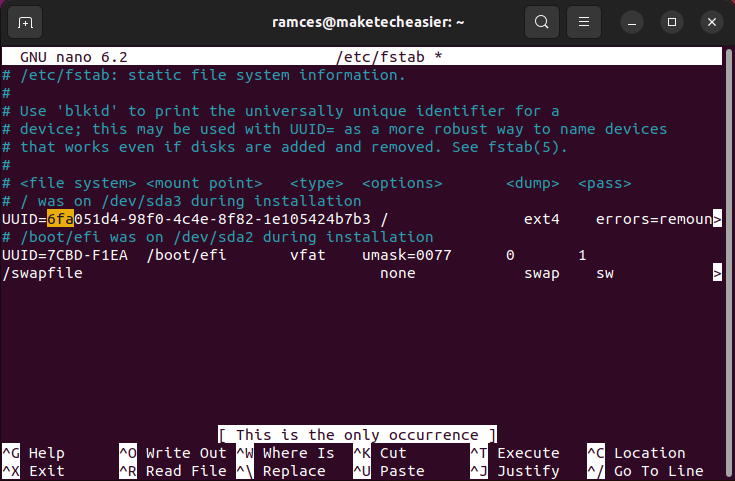 A terminal window showing the default /etc/fstab file for the demonstration system.